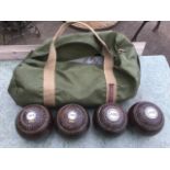 A set of four hardwood bowls with inlaid medallions. (4)