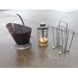 A helmet shaped copper coal bucket with swing handle; a Tilley lamp with domed reservoir; and a 60s