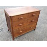 A deco oak chest of three long drawers mounted with rectangular handles, with panelled ends.