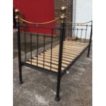 A Victorian style brass and iron bed