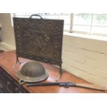 A wartime steel helmet with stag crest