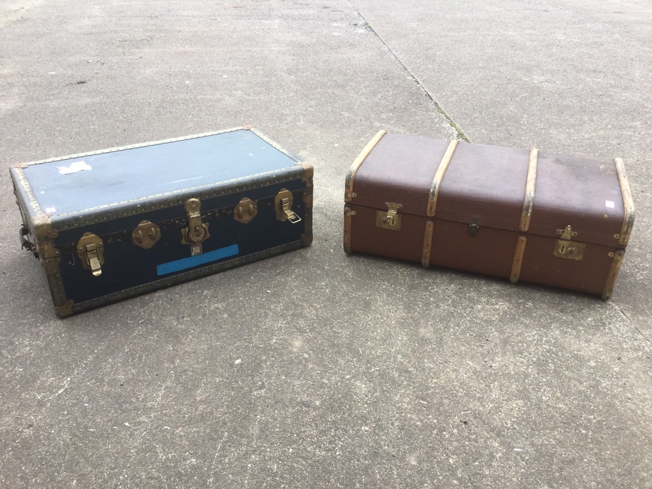 A hessian covered school trunk with wood slats, brass mounts and leather handles; and another trunk