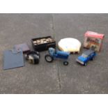 A box of childrens items including a set of bricks, a tractor, a school slate, a model jeep