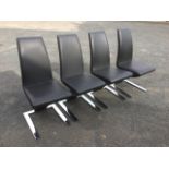 A set of four contemporary Italian style dining chairs