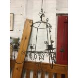 A wirework hanging chandelier with four candleholders