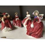 Four Royal Doulton figurines of ladies in red