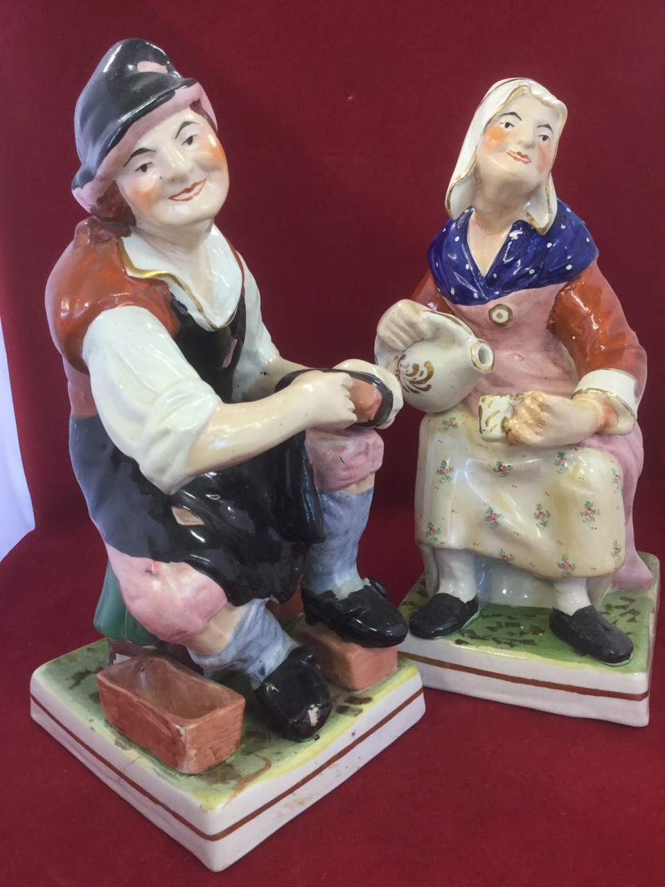 The Cobbler and Martha Gunn, a pair of large Victorian Staffordshire figurines