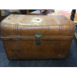 A scumbled tin trunk, with ribbed domed lid, mounted with brass lock & hasp