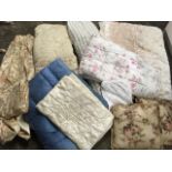 Five bedspreads, four with floral motifs, plus a childs quilted bedspread