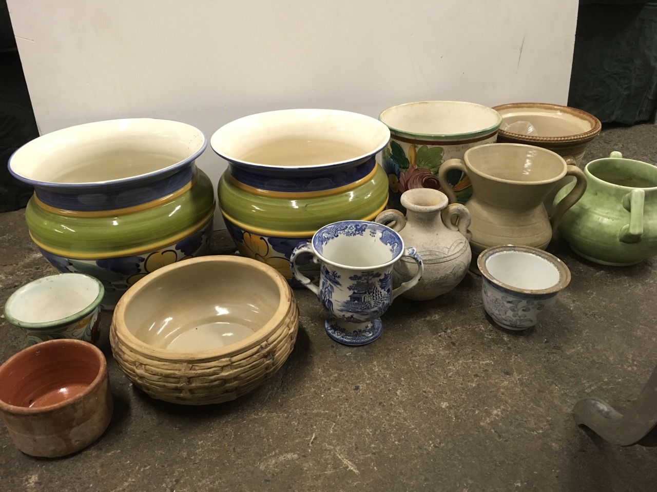 A pair of brightly handpainted Portuguese jardineres; and other plant pots