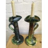 A pair of sancai glazed chamber candlesticks