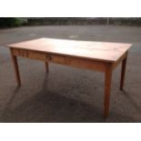 A large pine kitchen table