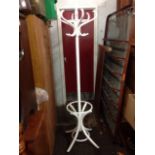 A painted bentwood coatstand with six scrolled hooks