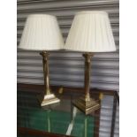 A pair of brass tablelamps