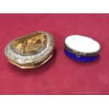 A Bilston enamel type oval box with panel to lid