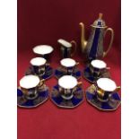 A blue and gold Royal Doulton coffee set, comprising of six cups & saucers