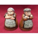 A Royal Doulton salt & pepper set - Votes for Women and Toil for Men, hand decorated, 1996. (2)