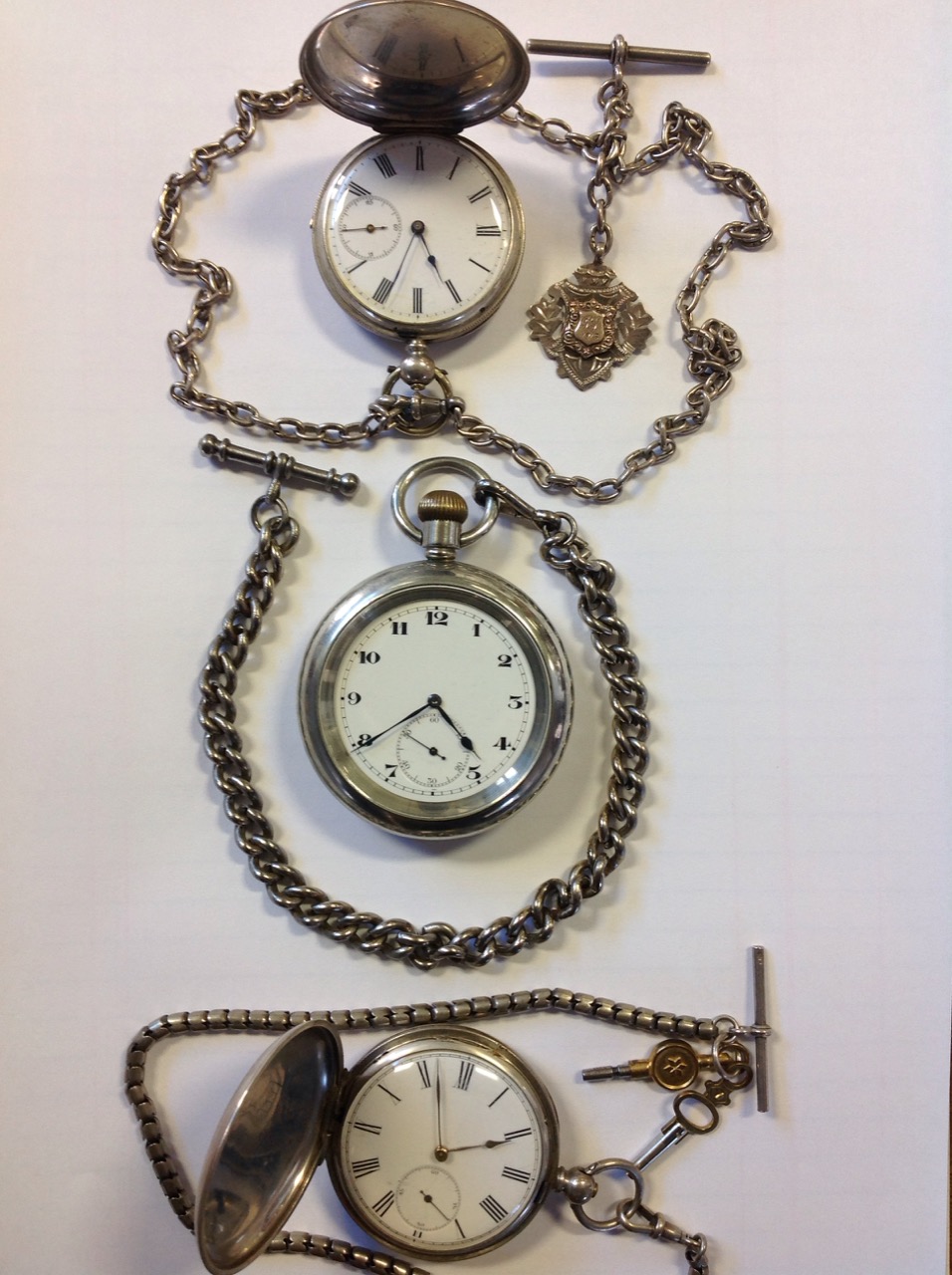 A silver pocket watch with enamelled dial