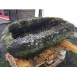 A massive ancient boulder carved as a basin. (39in x 22.5in)