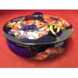 A tube-lined Moorcroft bowl & cover, decorated in the anemone pattern