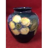 A small Moorcroft tube-line vase