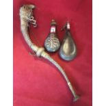 Two nineteenth century powder horns with brass mounts