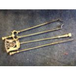 A set of three Victorian brass fire irons