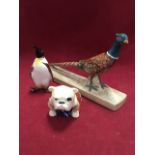 Three animal figurines - a Beswick pheasant on pottery base, model 1774 (1961 - 1975); a Beswick