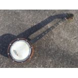 A five string banjo by Dulcetta of London
