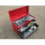 A metal three-drawer toolbox containing a range of tools