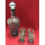 A Venetian glass decanter with four matching wine glasses