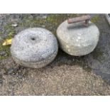 An early curling stone with cast iron handle; and a granite curling stone. (2)