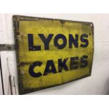 An enamelled advertising sign for Lyons Cakes