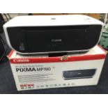 A boxed Canon Pixma MP190 all-in-one photo printer, with cables.