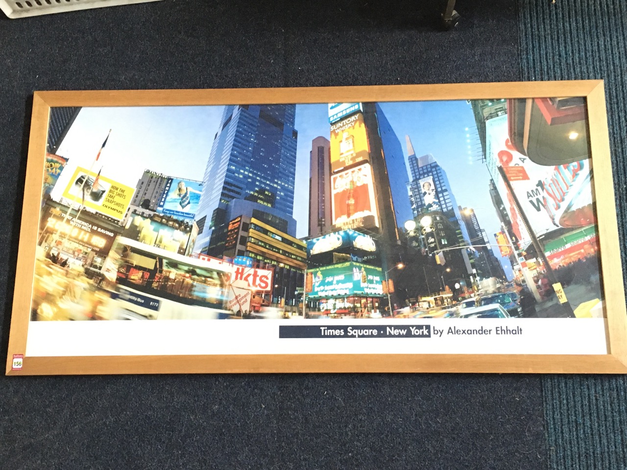 A large rectangular photographic print of Times Square