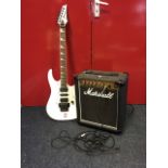 An Ibanez electric guitar with Marshall Reverb 12 amplifier