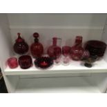 A collection of cranberry glass