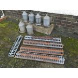 A set of six Eltex tubular galvanised chicken feeders