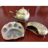 A Kenyan bronze dish cast in the form of a lions paw, signed and dated on base; a brass teapot