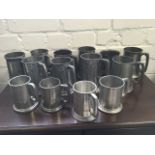 Ten Pewter pint tankards of various designs; and four half-pint tankards. (14)