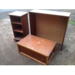 A mahogany bedside cupboard with open shelves raised on bracket feet