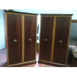 A pair of large mahogany wardrobes