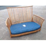 An Ercol slatback elm sofa