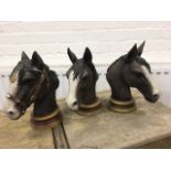 Three horse heads from the Leonardo collection on circular moulded socle bases. (3)