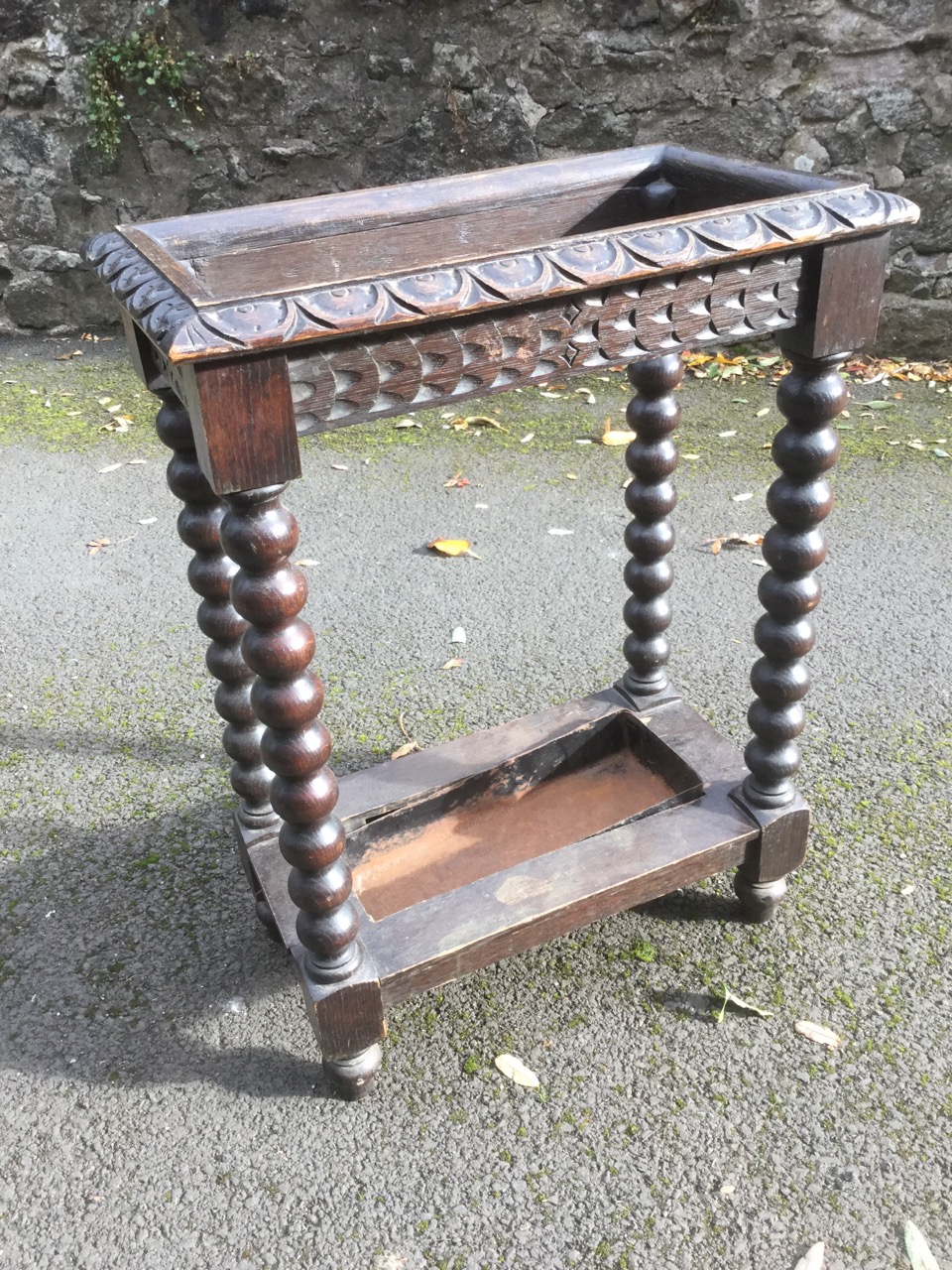 A rectangular Victorian carved oak/umbrella stickstand