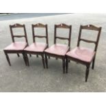 A set of four Victorian walnut dining chairs