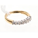 Diamond half hoop eternity ring with a row of seven brilliant cut diamonds in claw setting,