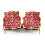 Pair of late 19th century French giltwood tub chairs with floral carved decoration,
