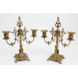 Pair Victorian brass two-branch candlesticks with lion supports on clover leaf feet,