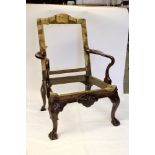 Fine walnut open armchair frame with crook arms and shell cartouche frieze on kick-back rear legs